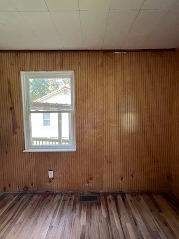 100 Park Circle Waverly, TN 37185 - Photo 26 of 32 an empty room with wooden floor and windows