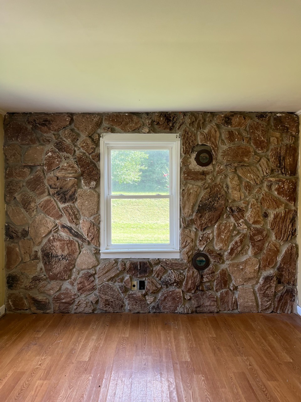 100 Park Circle Waverly, TN 37185 - Photo 4 of 32 an empty room with wooden floor and a fireplace