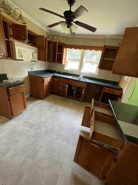 100 Park Circle Waverly, TN 37185 - Photo 9 of 32 a kitchen with stainless steel appliances kitchen island granite countertop a stove and a sink