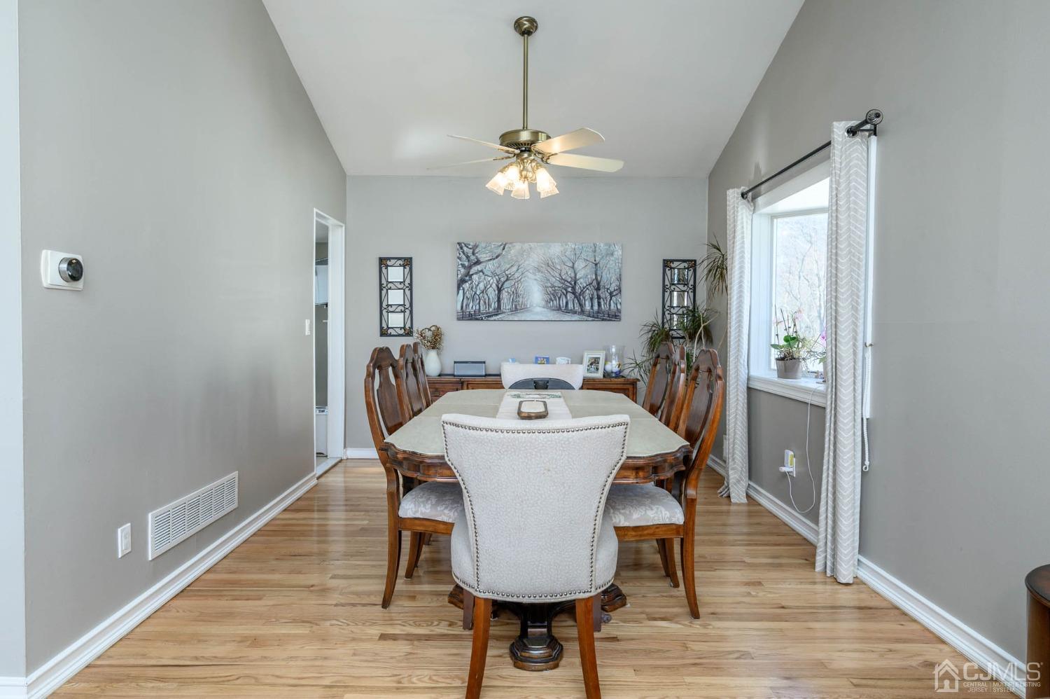 44 Owens Road Old Bridge, NJ 08857 - Photo 15 of 48 a view of a dining room with furniture wooden floor and a chandelier