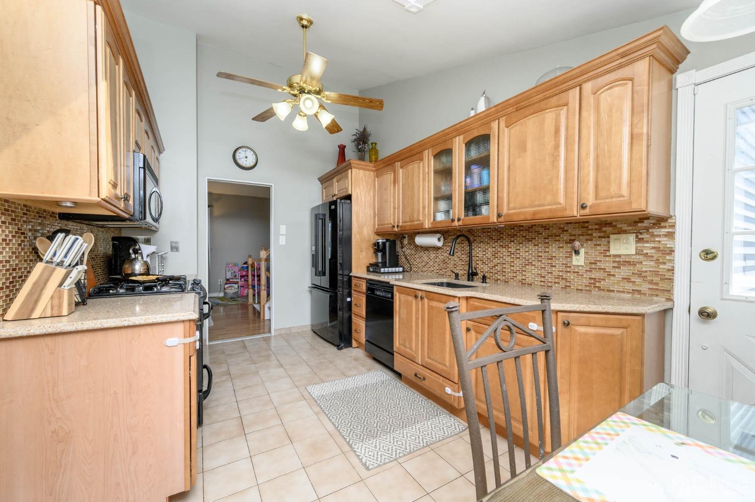 44 Owens Road Old Bridge, NJ 08857 - Photo 18 of 48 a kitchen with stainless steel appliances granite countertop a sink a stove cabinets counter space and a window