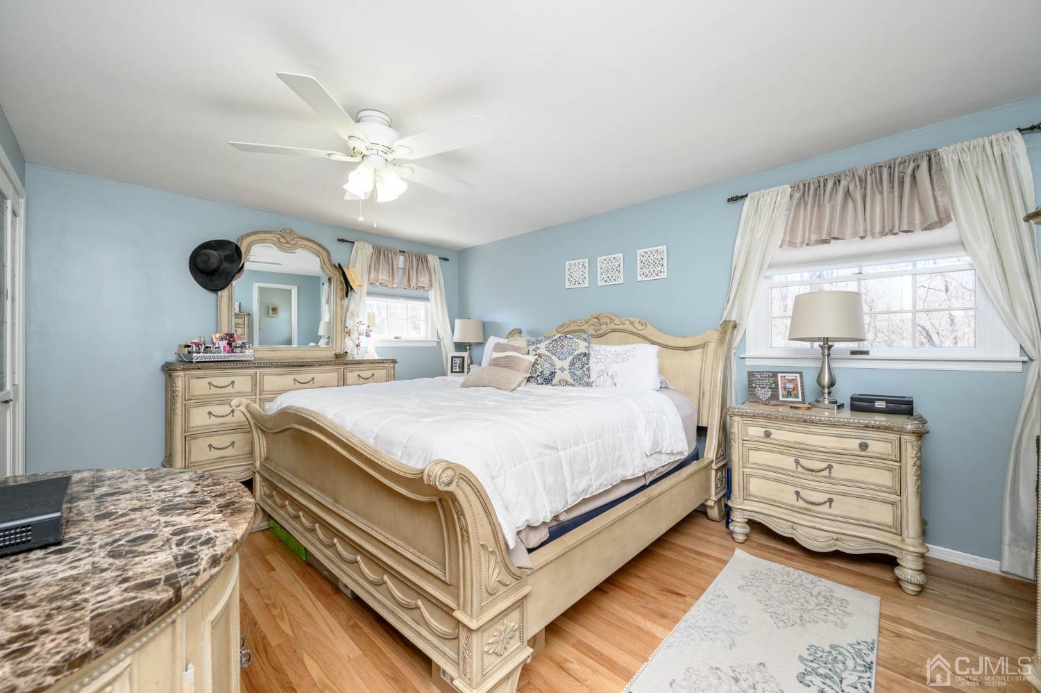44 Owens Road Old Bridge, NJ 08857 - Photo 25 of 48 a bedroom with a bed and a chandelier