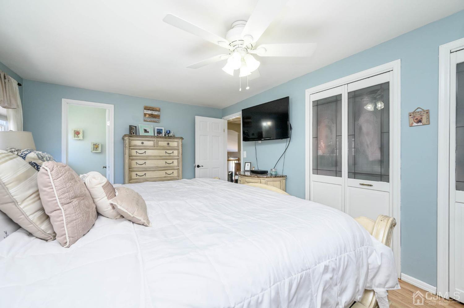 44 Owens Road Old Bridge, NJ 08857 - Photo 26 of 48 a bedroom with a large bed and a flat tv screen on dresser
