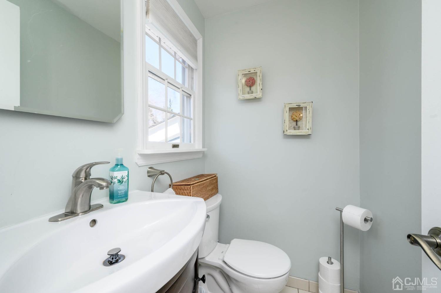 44 Owens Road Old Bridge, NJ 08857 - Photo 27 of 48 a bathroom with a sink mirror and toilet
