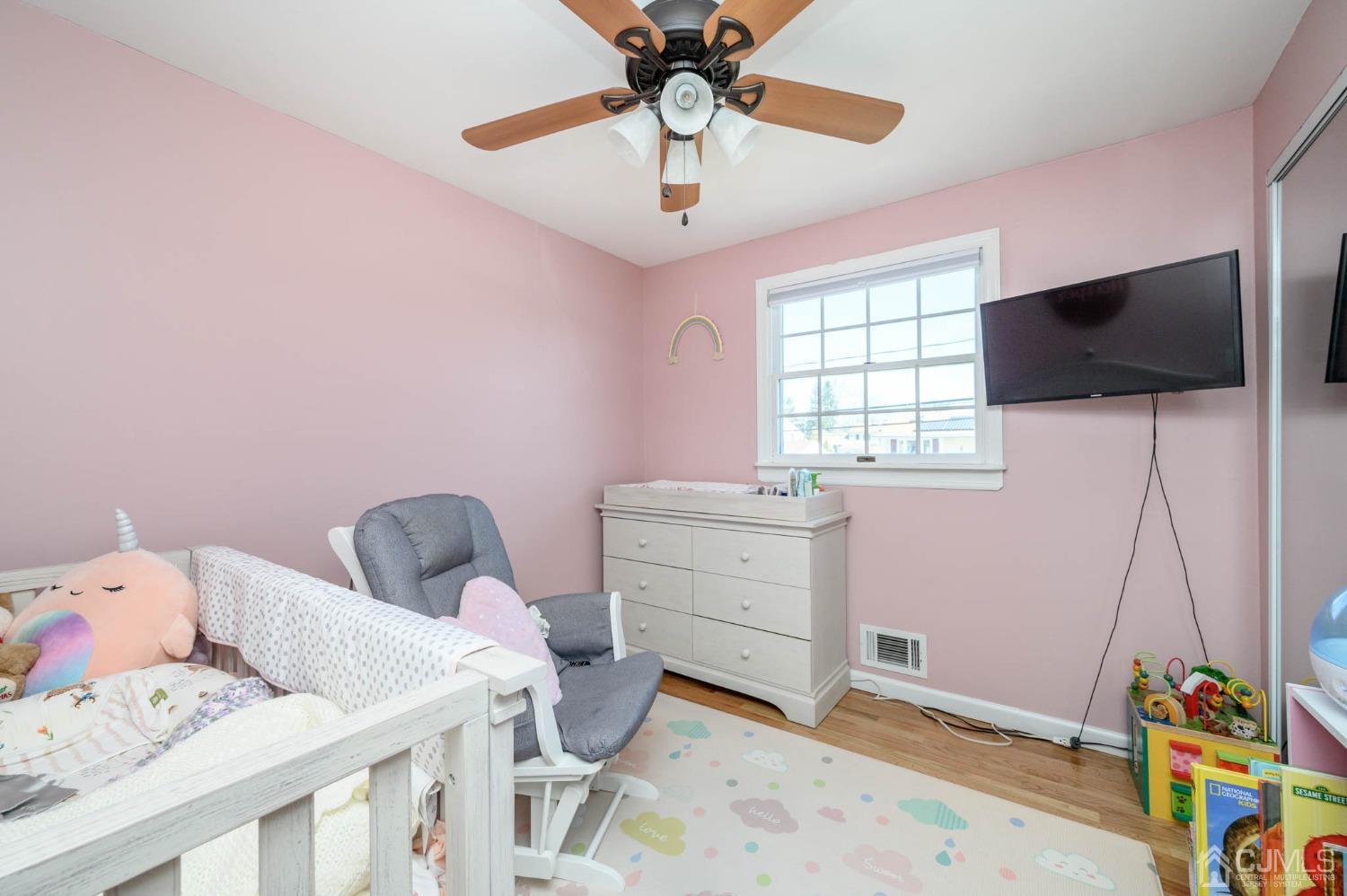 44 Owens Road Old Bridge, NJ 08857 - Photo 29 of 48 a room with a baby bed baby crib and a window