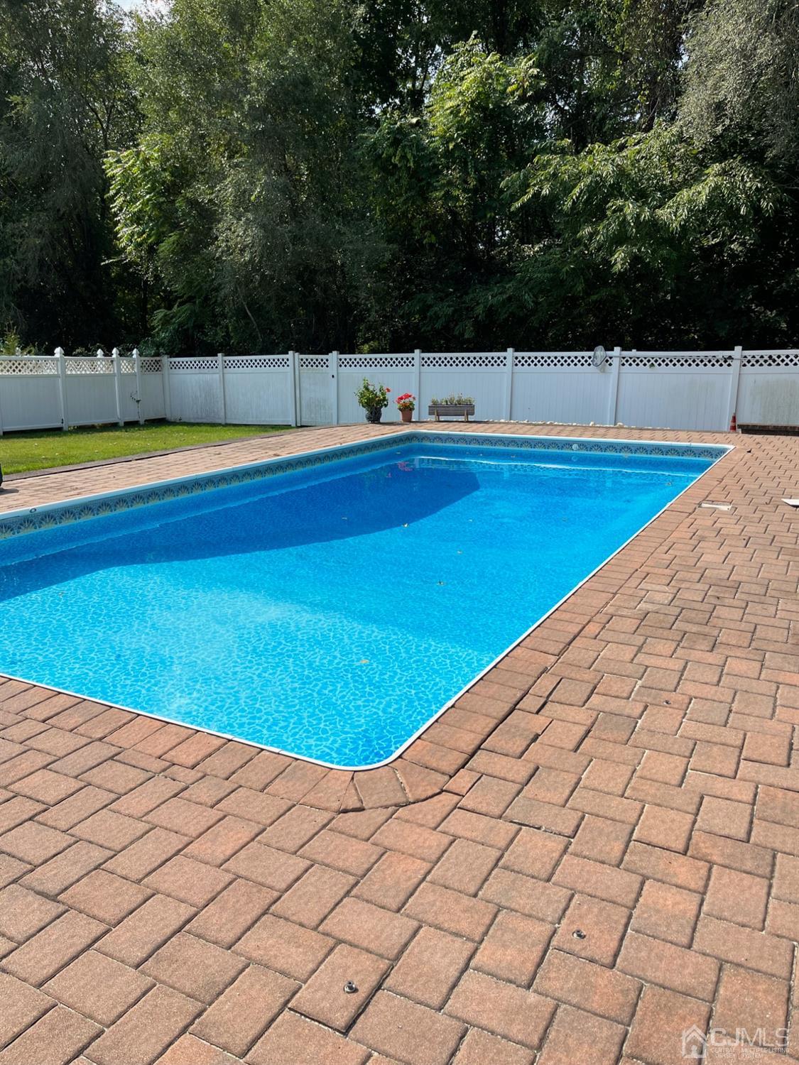 44 Owens Road Old Bridge, NJ 08857 - Photo 39 of 48 a view of swimming pool and trees in the background