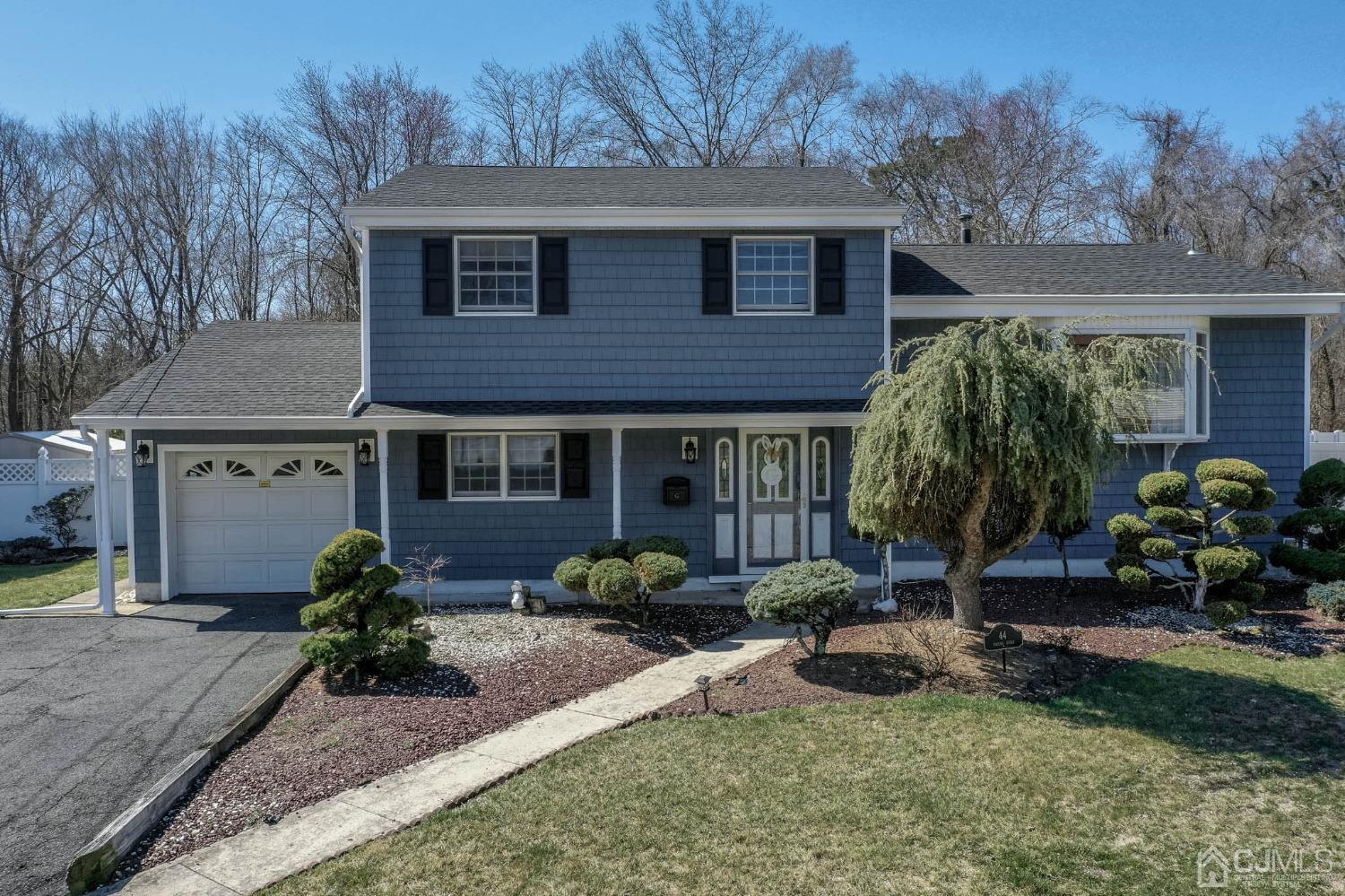 44 Owens Road Old Bridge, NJ 08857 - Photo 40 of 48 a front view of a house with garden and porch