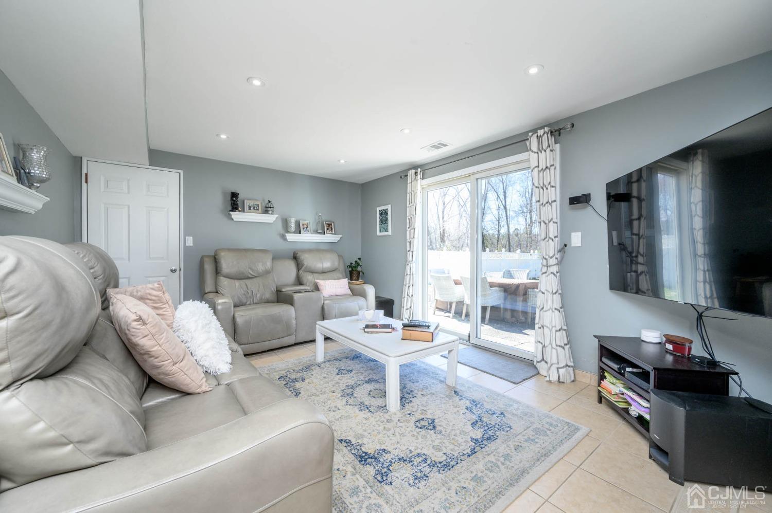 44 Owens Road Old Bridge, NJ 08857 - Photo 6 of 48 a living room with furniture and a large window