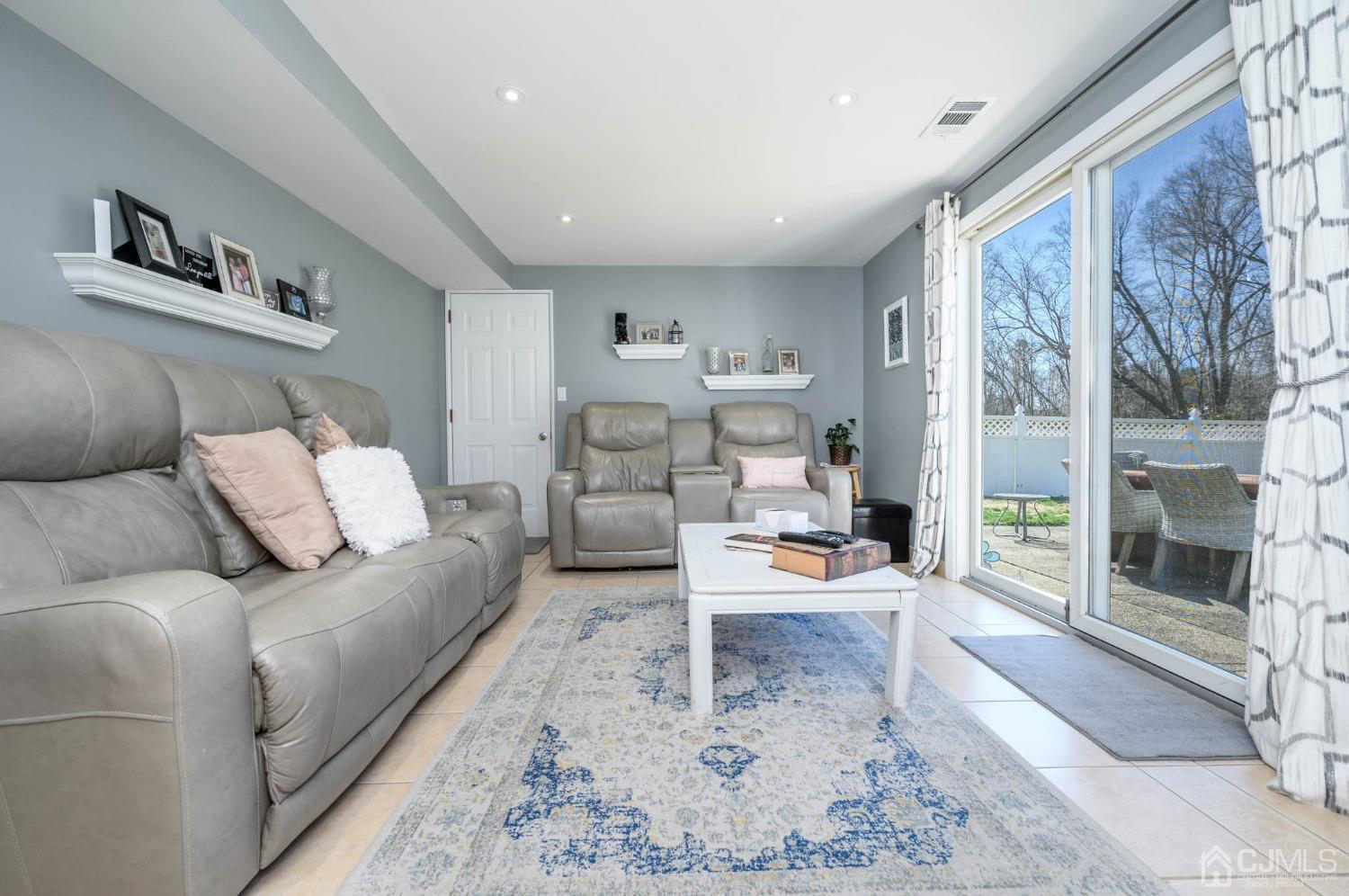 44 Owens Road Old Bridge, NJ 08857 - Photo 8 of 48 a living room with furniture and a large window
