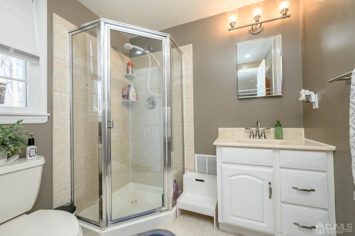 44 Owens Road Old Bridge, NJ 08857 - Photo 9 of 48 a bathroom with a granite countertop sink toilet and shower