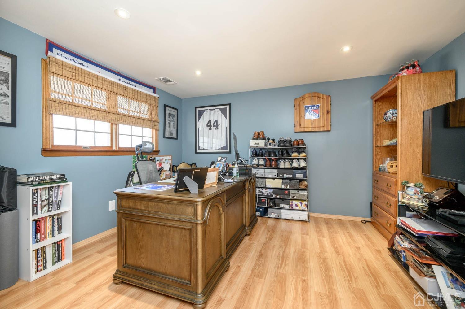 44 Owens Road Old Bridge, NJ 08857 - Photo 10 of 48 a room with furniture a flat screen tv and a window