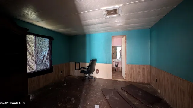 a living room with furniture and a gate