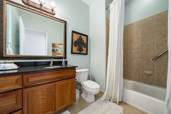 a bathroom with a toilet a sink and bathtub