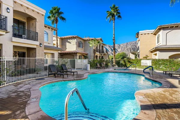 a view of a swimming pool with a lounge chairs