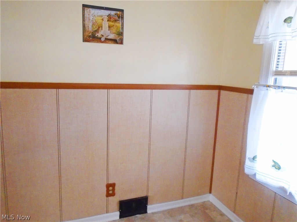 847 Reed Avenue Akron, OH 44306 - Photo 8 of 23 Eat-in-kitchen area with wainscoting and new flooring!