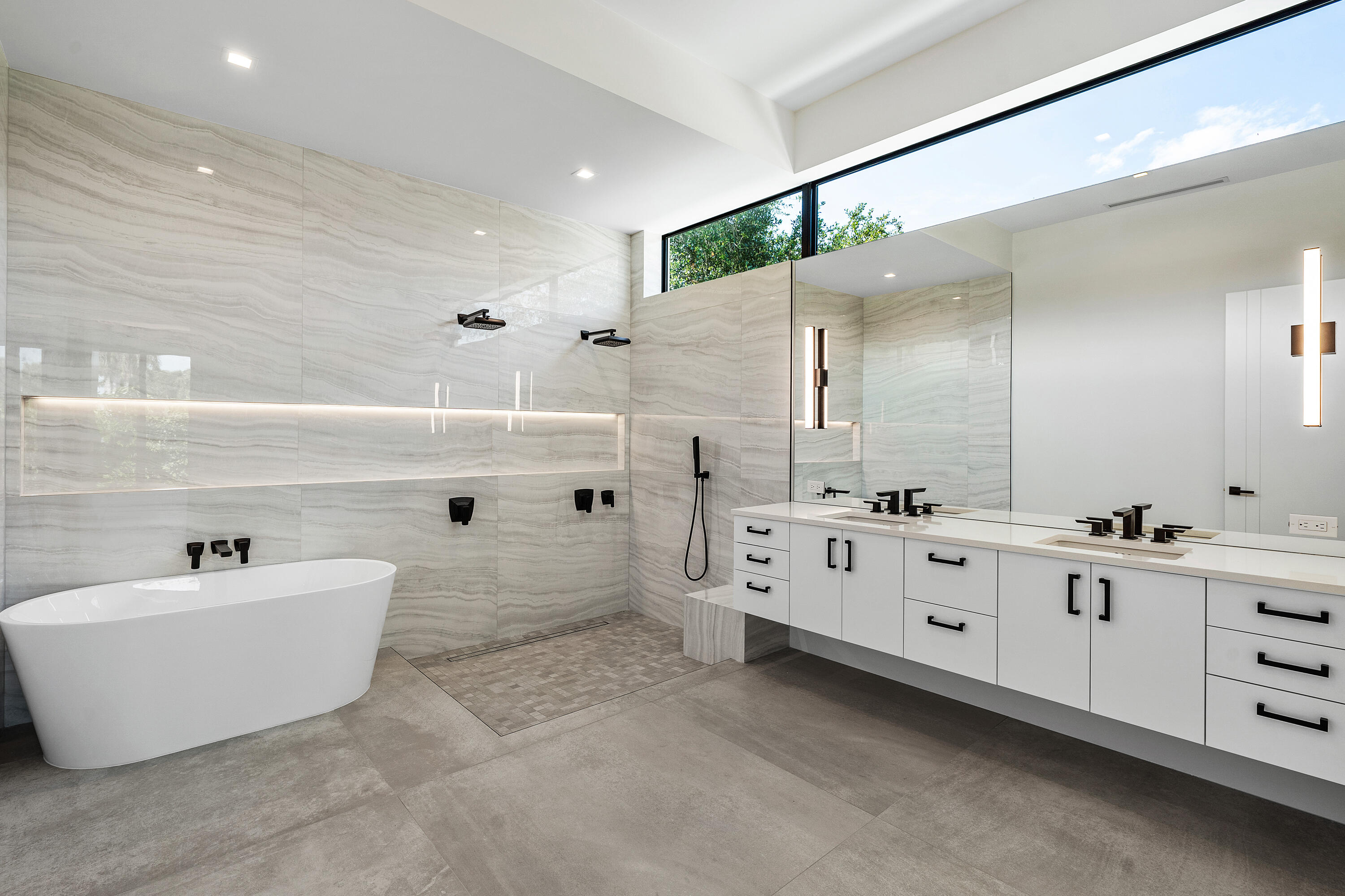 10 Coconut Road Delray Beach, FL 33444 - Photo 14 of 41 a large white bathroom with double vanity sink a mirror and a bathtub