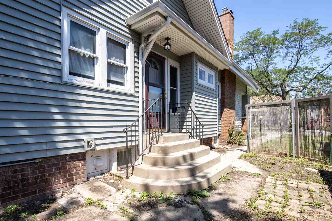 1719 Post Avenue Rockford, IL 61103 - Photo 17 of 29 a front view of a house with a yard