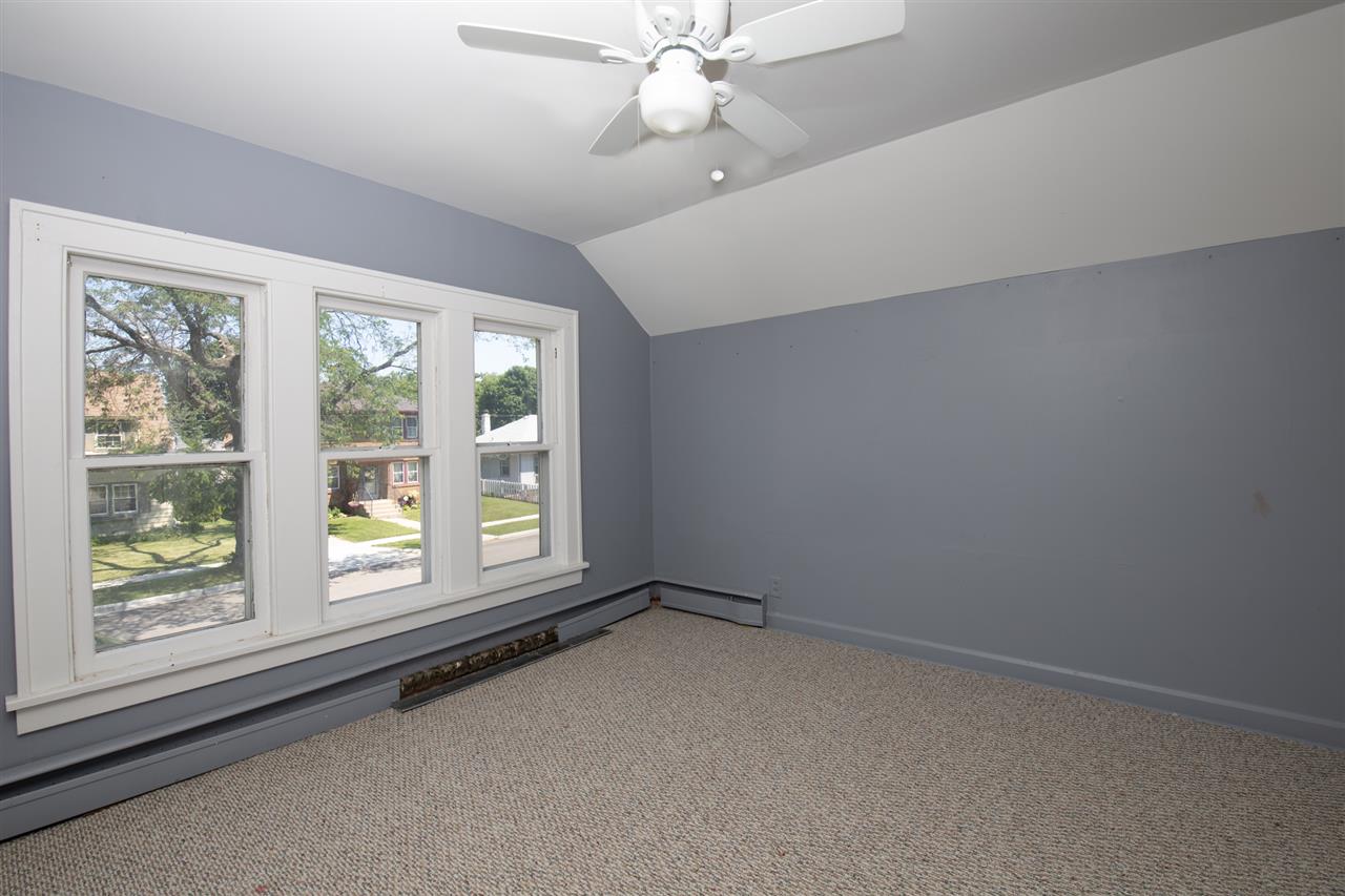 1719 Post Avenue Rockford, IL 61103 - Photo 22 of 29 an empty room with a window and a fan