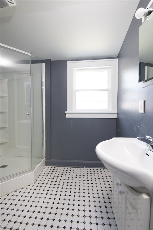 1719 Post Avenue Rockford, IL 61103 - Photo 23 of 29 a bathroom with a sink a toilet and shower