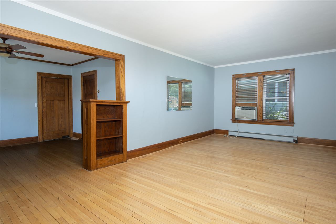 1719 Post Avenue Rockford, IL 61103 - Photo 5 of 29 a view of empty room with wooden floor and fan