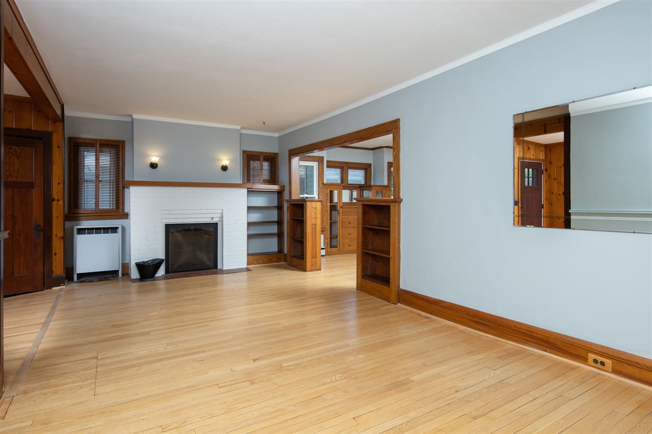 1719 Post Avenue Rockford, IL 61103 - Photo 6 of 29 a view of an empty room with a fireplace and a window