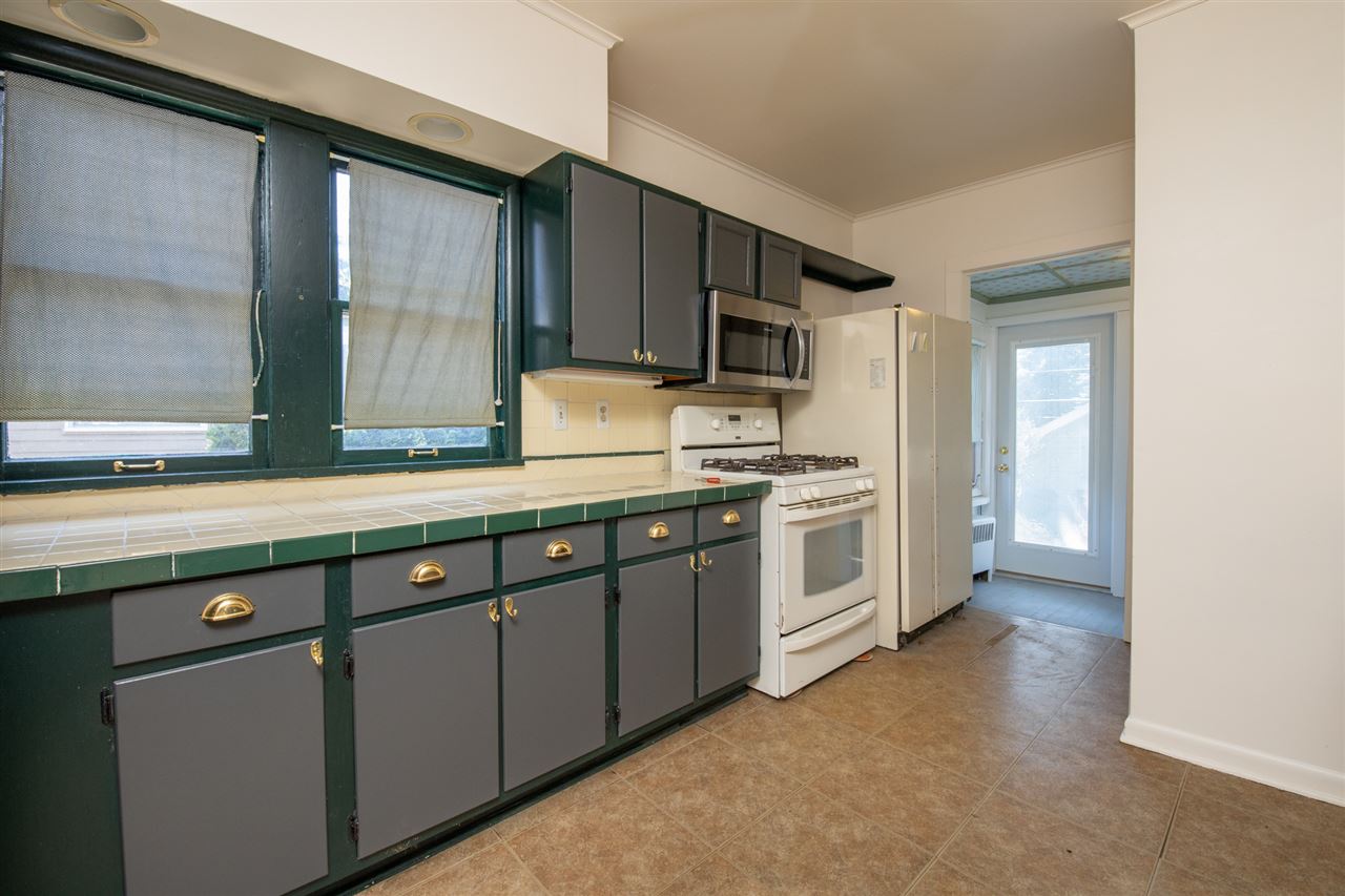 1719 Post Avenue Rockford, IL 61103 - Photo 9 of 29 a kitchen with stainless steel appliances a refrigerator sink and microwave