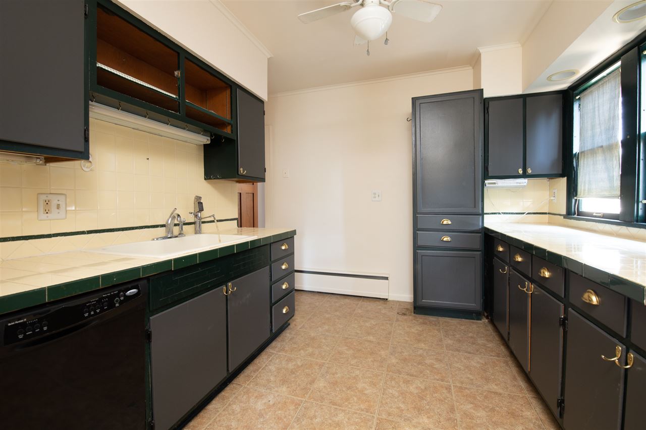 1719 Post Avenue Rockford, IL 61103 - Photo 10 of 29 a kitchen with a sink and a refrigerator