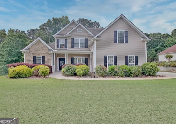 front view of a house with a yard