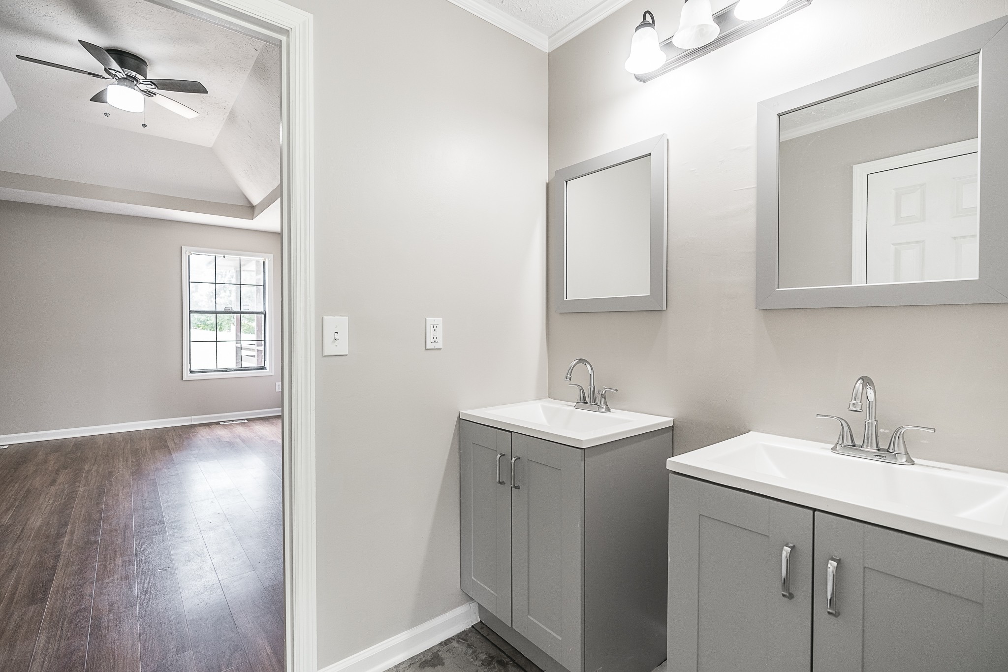 467 Calista Road White House, TN 37188 - Photo 11 of 33 Primary bath with new flooring, cabinets fixtures and mirrors