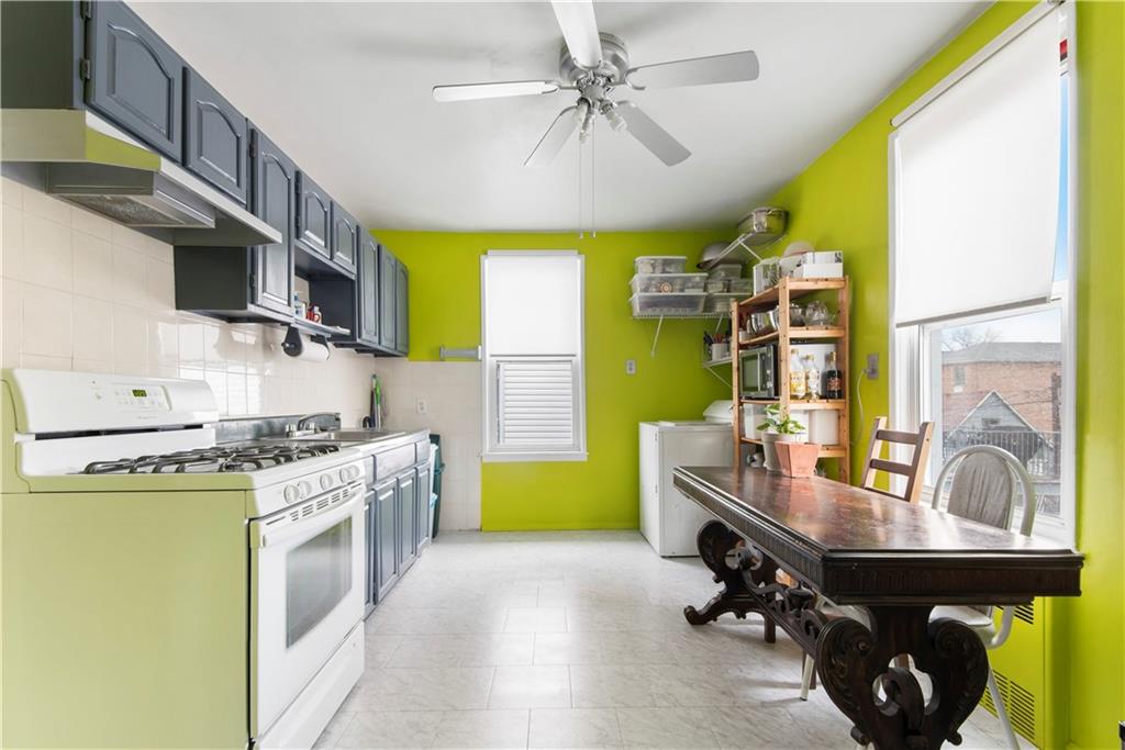 8745 17th Avenue Brooklyn, NY 11214 - Photo 13 of 31 a kitchen with a sink appliances and cabinets