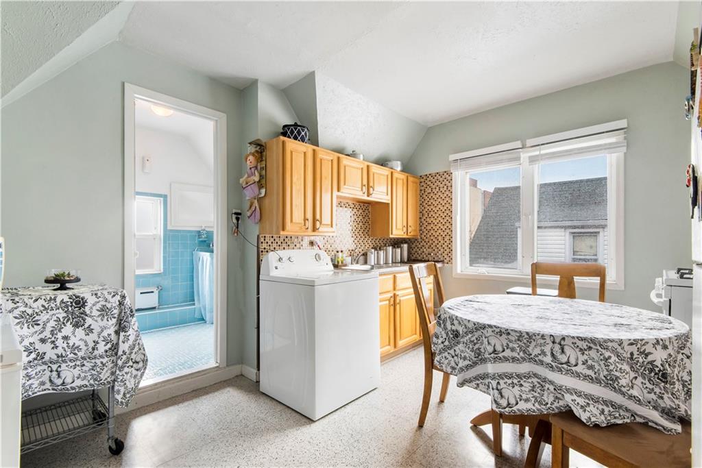 8745 17th Avenue Brooklyn, NY 11214 - Photo 20 of 31 a dining room with furniture and window