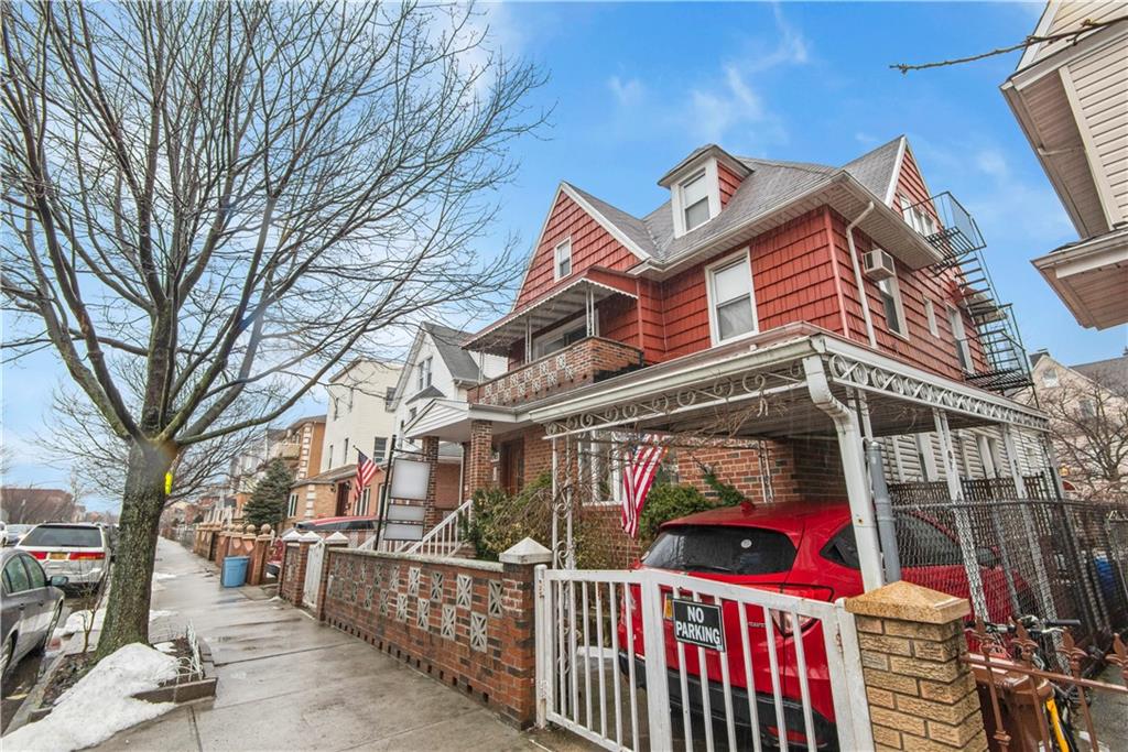 8745 17th Avenue Brooklyn, NY 11214 - Photo 2 of 31 a view of a building with wooden fence