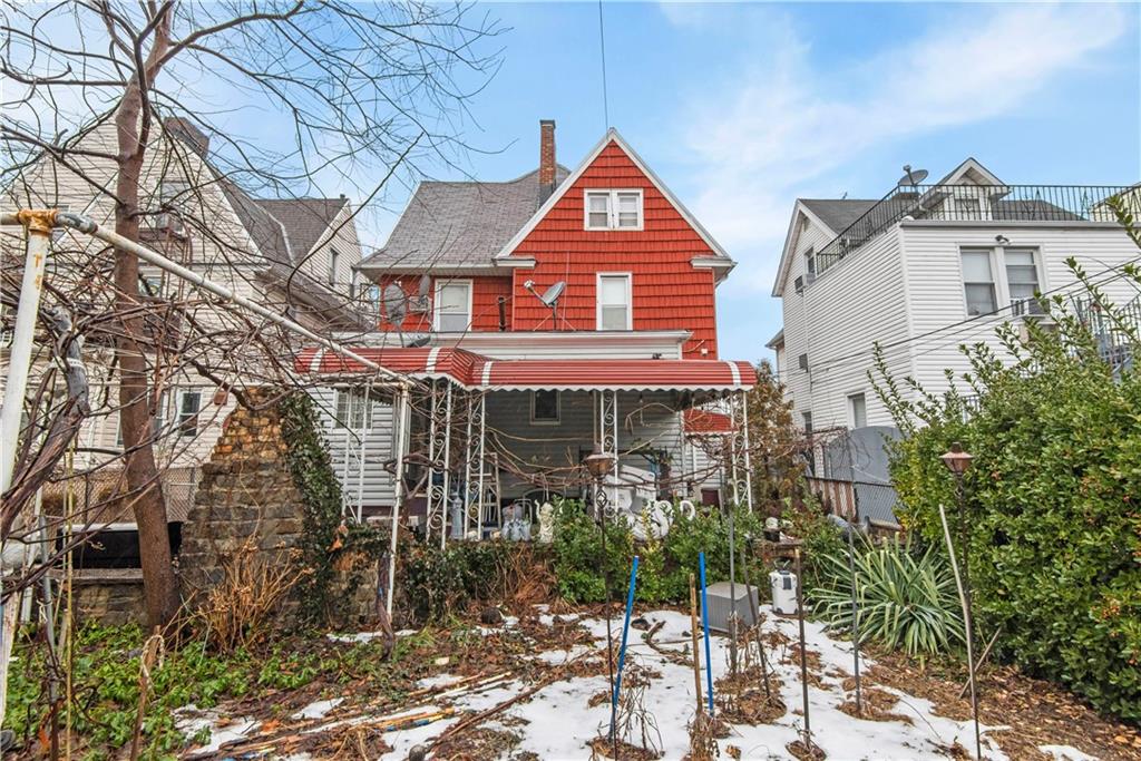8745 17th Avenue Brooklyn, NY 11214 - Photo 29 of 31 a front view of a house with a yard