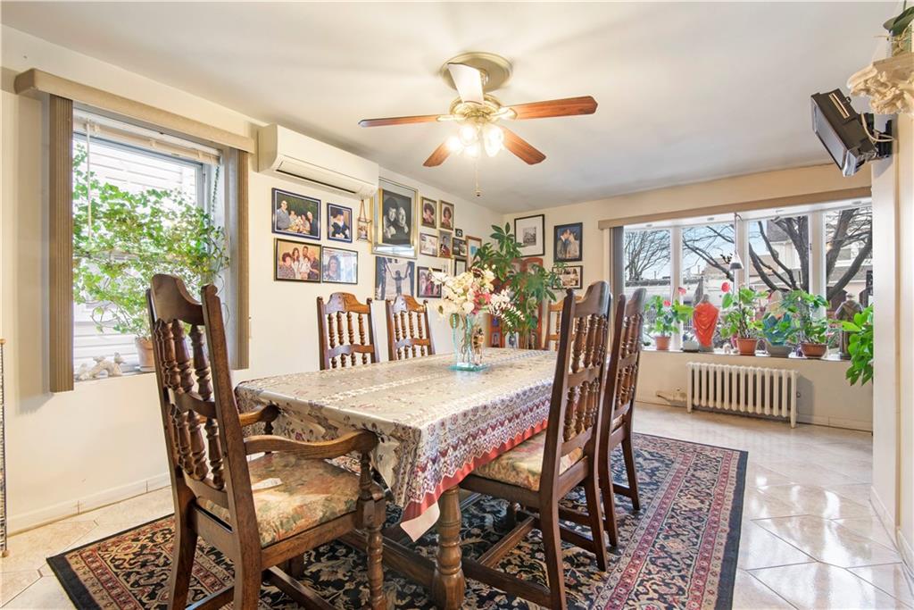 8745 17th Avenue Brooklyn, NY 11214 - Photo 9 of 31 a view of a dining room with furniture window and outside view