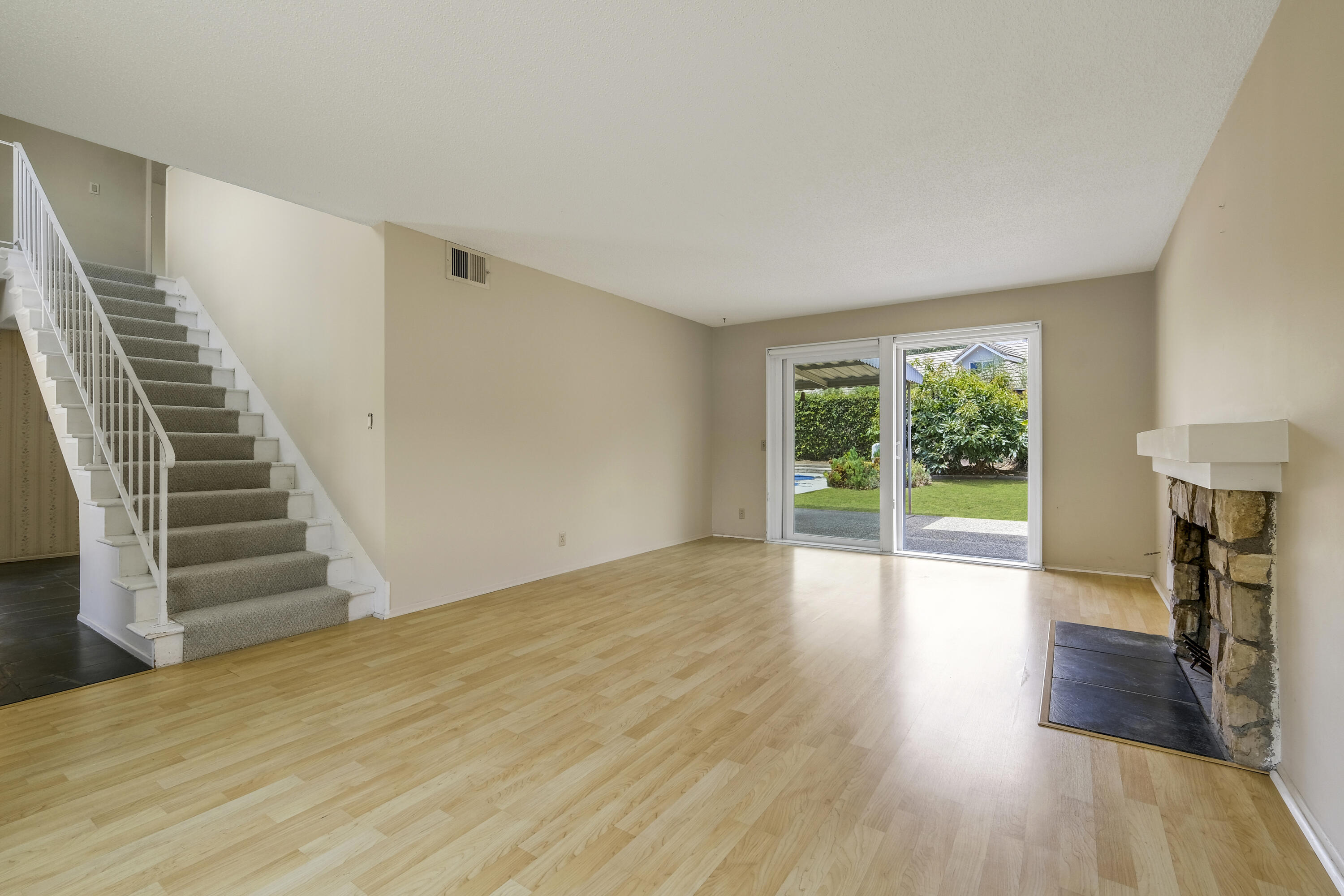 5376 Berkeley Road Santa Barbara, CA 93111 - Photo 3 of 18 a view of an empty room with wooden floor and a window