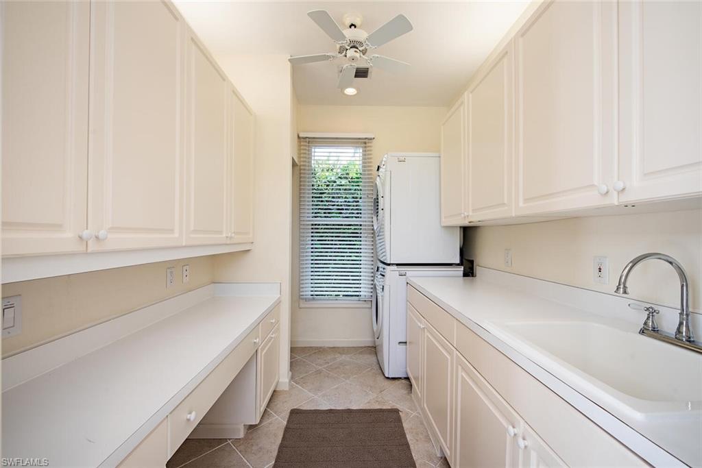 369 2nd Avenue North Naples, FL 34102 - Photo 11 of 25 a kitchen with a sink and cabinets