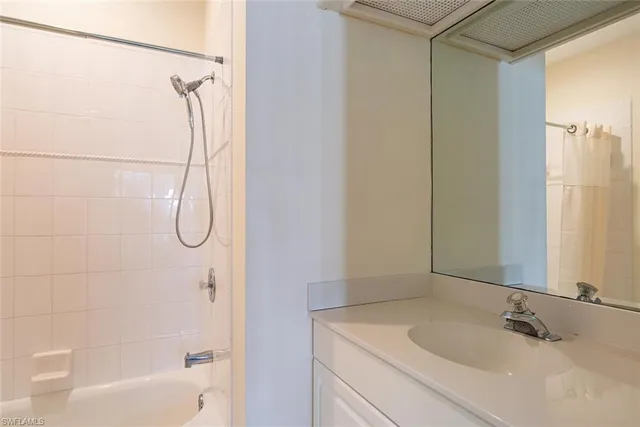 a bathroom with a sink and a shower