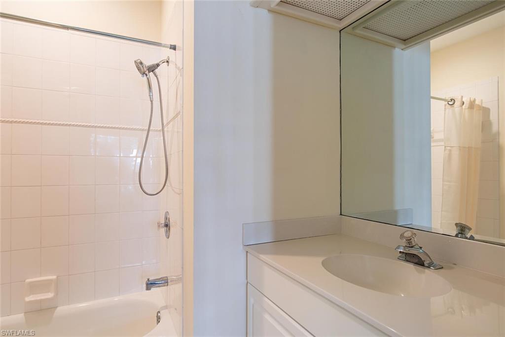 369 2nd Avenue North Naples, FL 34102 - Photo 15 of 25 a bathroom with a sink and a shower