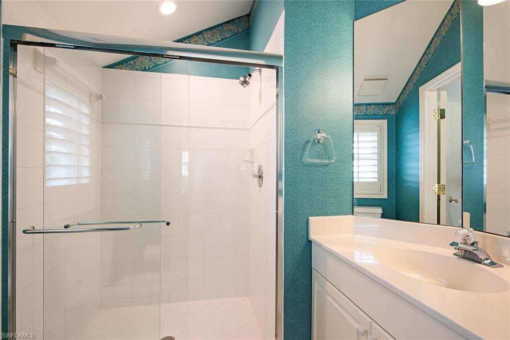 369 2nd Avenue North Naples, FL 34102 - Photo 17 of 25 a bathroom with a shower and a sink