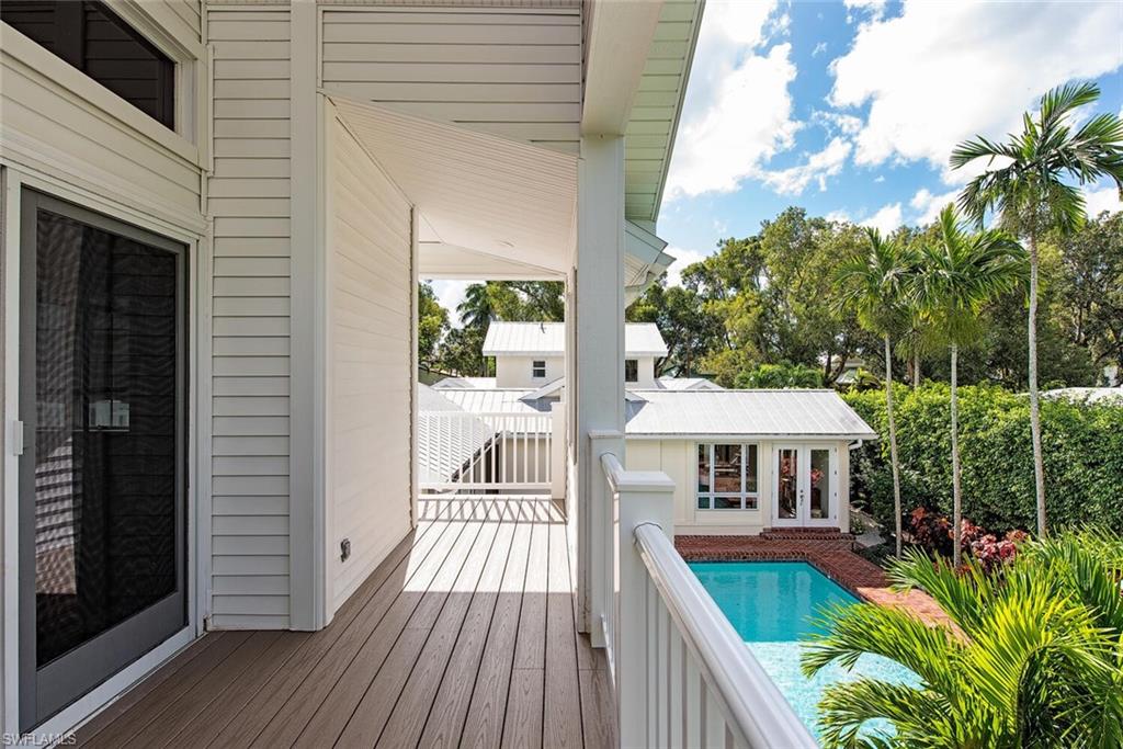 369 2nd Avenue North Naples, FL 34102 - Photo 18 of 25 a front view of a house with yard and balcony