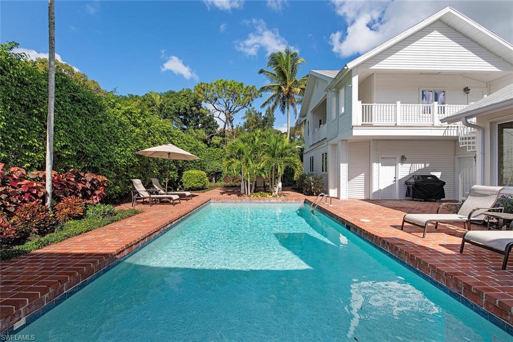 369 2nd Avenue North Naples, FL 34102 - Photo 25 of 25 a view of a house with backyard and sitting area