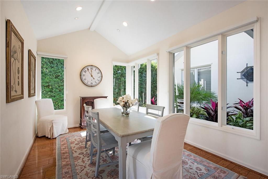 369 2nd Avenue North Naples, FL 34102 - Photo 5 of 25 a living room with furniture and a large window