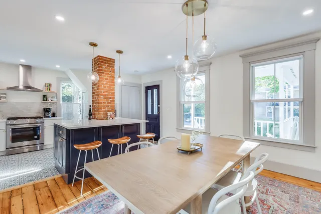 a living room with dining table
