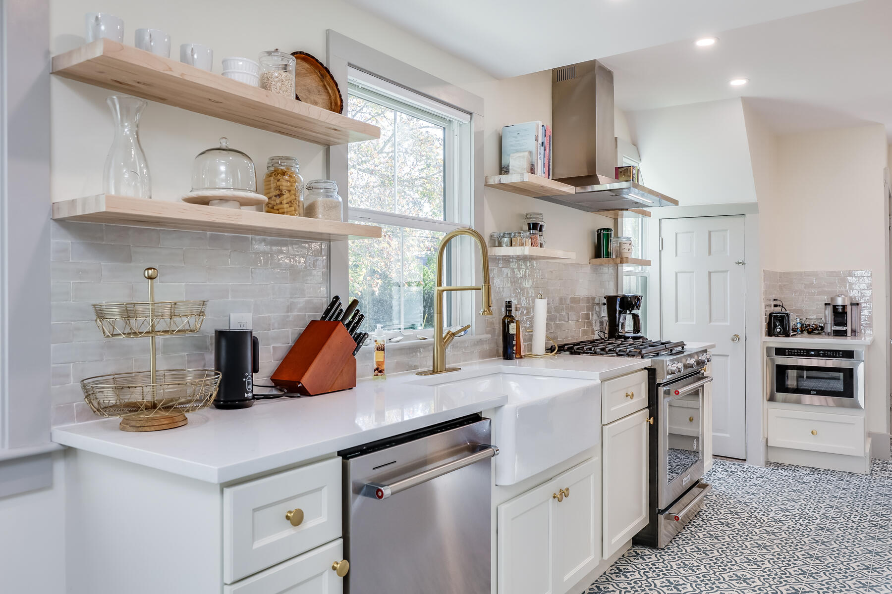 3 High Street Falmouth, MA 02543 - Photo 17 of 52 a kitchen with a sink a stove and cabinets