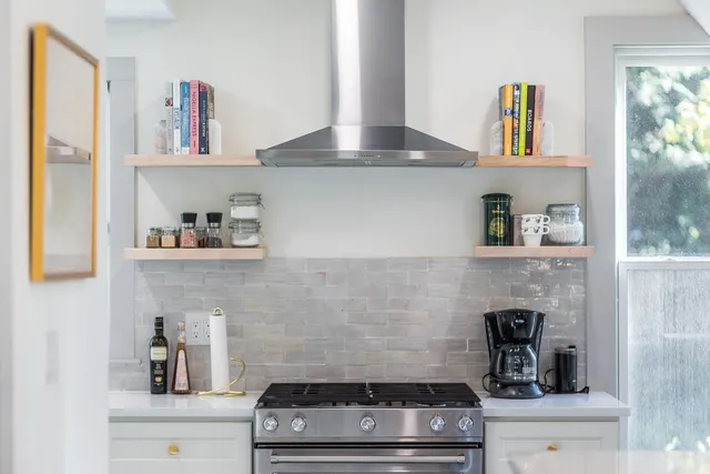 a kitchen with a stove and cabinets