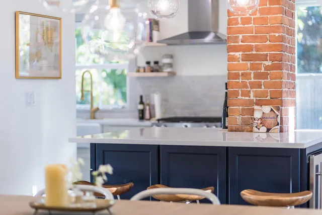 a view of a kitchen with a refrigerator and window