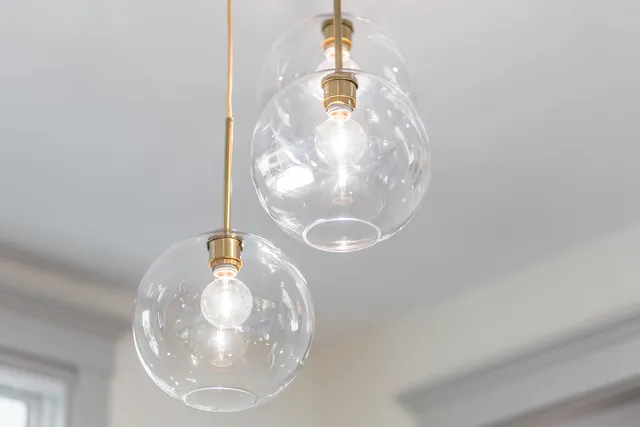a living room with furniture a rug and a large window