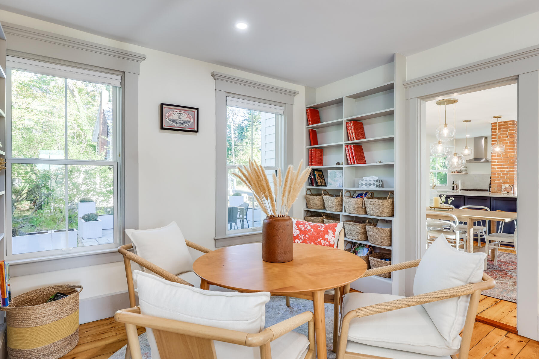 3 High Street Falmouth, MA 02543 - Photo 30 of 52 a view of a dining room with furniture and a book shelf