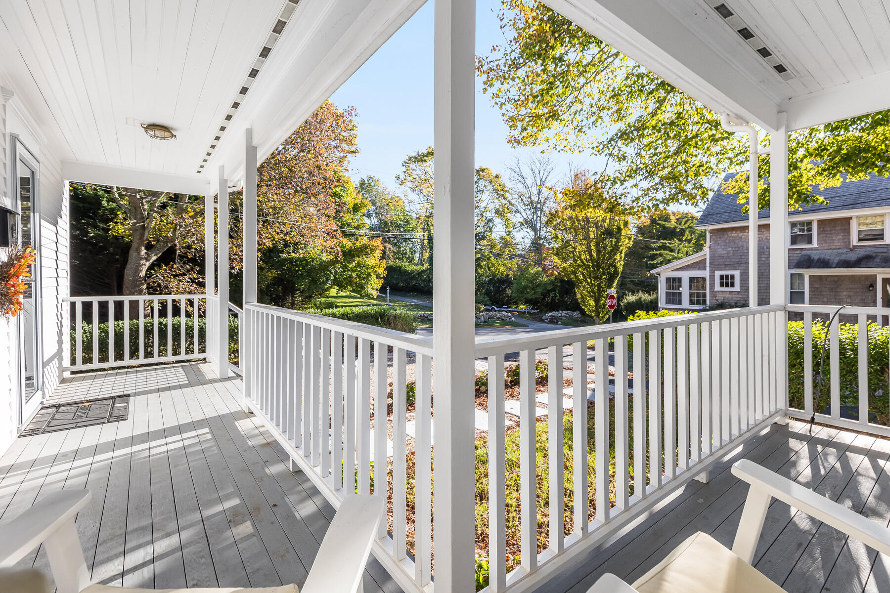 3 High Street Falmouth, MA 02543 - Photo 3 of 52 a view of a porch with a floor to ceiling window and wooden fence