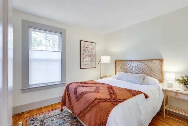 a view of a hallway with a big room and balcony view